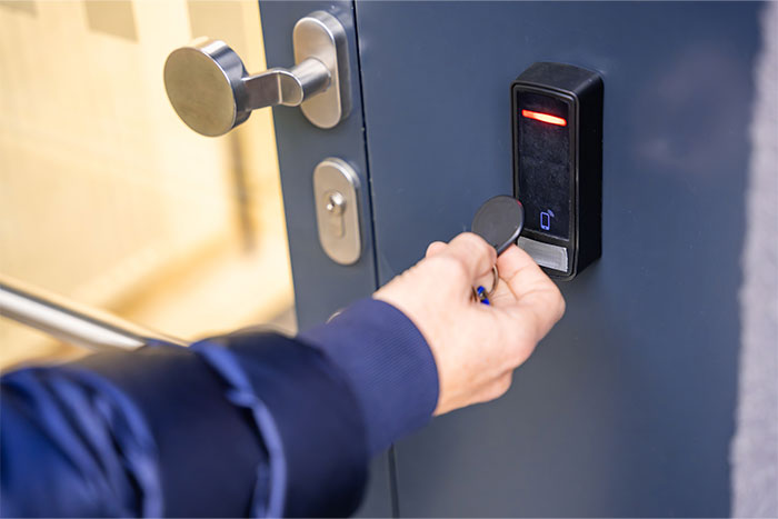 a person opening a door lock